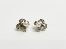 A pair of ladies 9ct gold and pearl earrings.