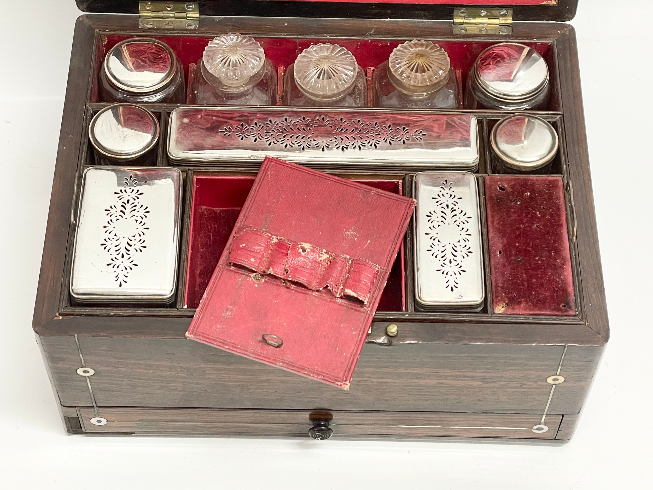 A Victorian rosewood vanity box with Mother of Pearl inlay and cut glass bottles with silver - Image 5 of 11