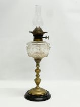 A late Victorian double burner oil lamp with cut glass bowl and brass column. 57cm