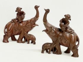 A pair of vintage Chinese Boxwood elephants with riders. 17x20cm