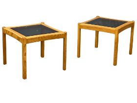 A pair of Ercol blonde Elm end table with smoked glass tops. 59x59x59cm