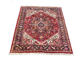 A large vintage Middle Eastern hand knotted rug. 179x253cm