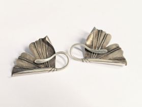 A pair of silver clip-on earrings