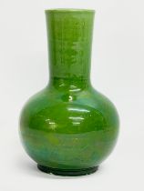A 20th century Japanese green glazed vase. Makers stamp on bottom. 15cm
