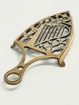 A late 19th century Irish crowned harp brass stand. 25cm