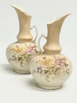 A pair of late 19th century Austrian hand painted porcelain ewers. 20cm