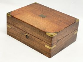 A Victorian rosewood brass bound stationary box. 29.5x22x12cm