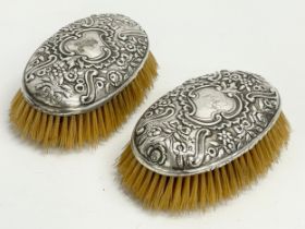 A pair of Victorian silver vanity brushes. London. W.C. 15x9cm