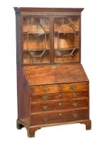 A late 18th century George III mahogany bureau bookcase with astragal glazed doors and closed fret