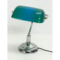 A desk lamp with plastic shade. 28x36cm