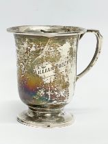 A silver christening mug. Stamped LSG. Birmingham. 69.71 grams.