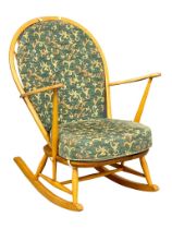 An Ercol Mid Century blonde Elm rocking chair.