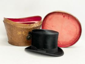 A Victorian leather hat box with a Christie’s of London top hat.