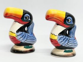 A pair of vintage Guinness toucan salt and pepper shakers.