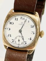 A 1930’s Omega 9ct gold ‘Cushion’ watch with leather strap.
