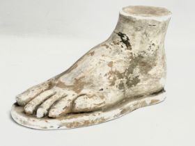 A late 19th/early 20th century plaster foot. 25x13cm