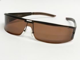 A pair of Gucci sunglasses.