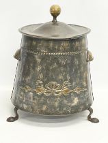 An early 20th century Art Nouveau brass coal bin with lid. 35x36x44cm.