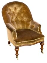 A Victorian deep button back armchair.