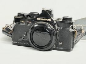 A vintage Olympus OM-2n camera.