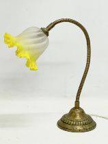 A 1930’s brass adjustable swan neck table lamp. 44cm