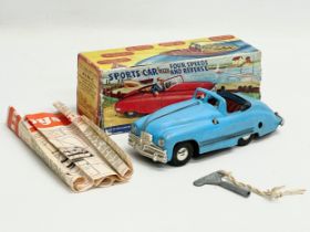 A vintage Tri-ang No.2 Minic Clockwork Scale Model Sports Car in box. Lines Bros LTD. With Four