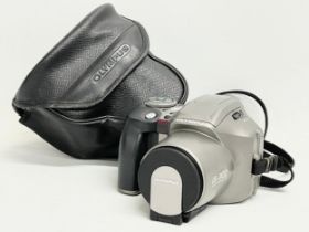 An Olympus IS-300 Glass Aspherical Lens camera with case.