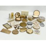 A collection of vintage compacts and perfume bottles