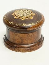 A late 19th/early 20th century lidded padauk treen with finely carved bone and hand painted gilding.
