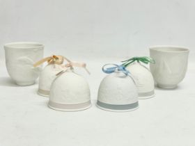 4 Lladro porcelain bells and 2 Lladro cups.