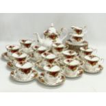 A 39 piece Royal Albert ‘Old Country Roses’ tea set. Teapot 25x15x20cm. 12 sandwich plates, 12 tea