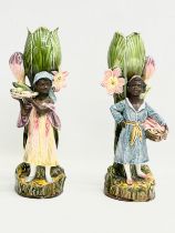 A pair of late 19th century French Barbotine Majolica figures. 6614. 30cm