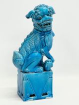 A large early 20th century Chinese glazed Foo Dog. 36.5cm