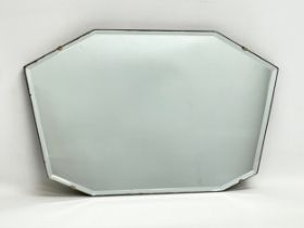 A 1930’s Art Deco bevelled mirror. 53x33cm