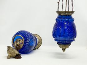 A pair of large vintage brass and Bristol Blue glass light shade. 68cm including chain.