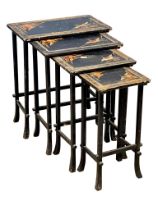 A large early 20th century Chinese style lacquered nest of tables with hand painted gilt bird and