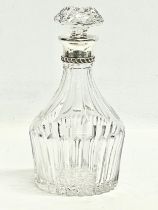 A good quality crystal silver mounted decanter. Asprey London. 24cm