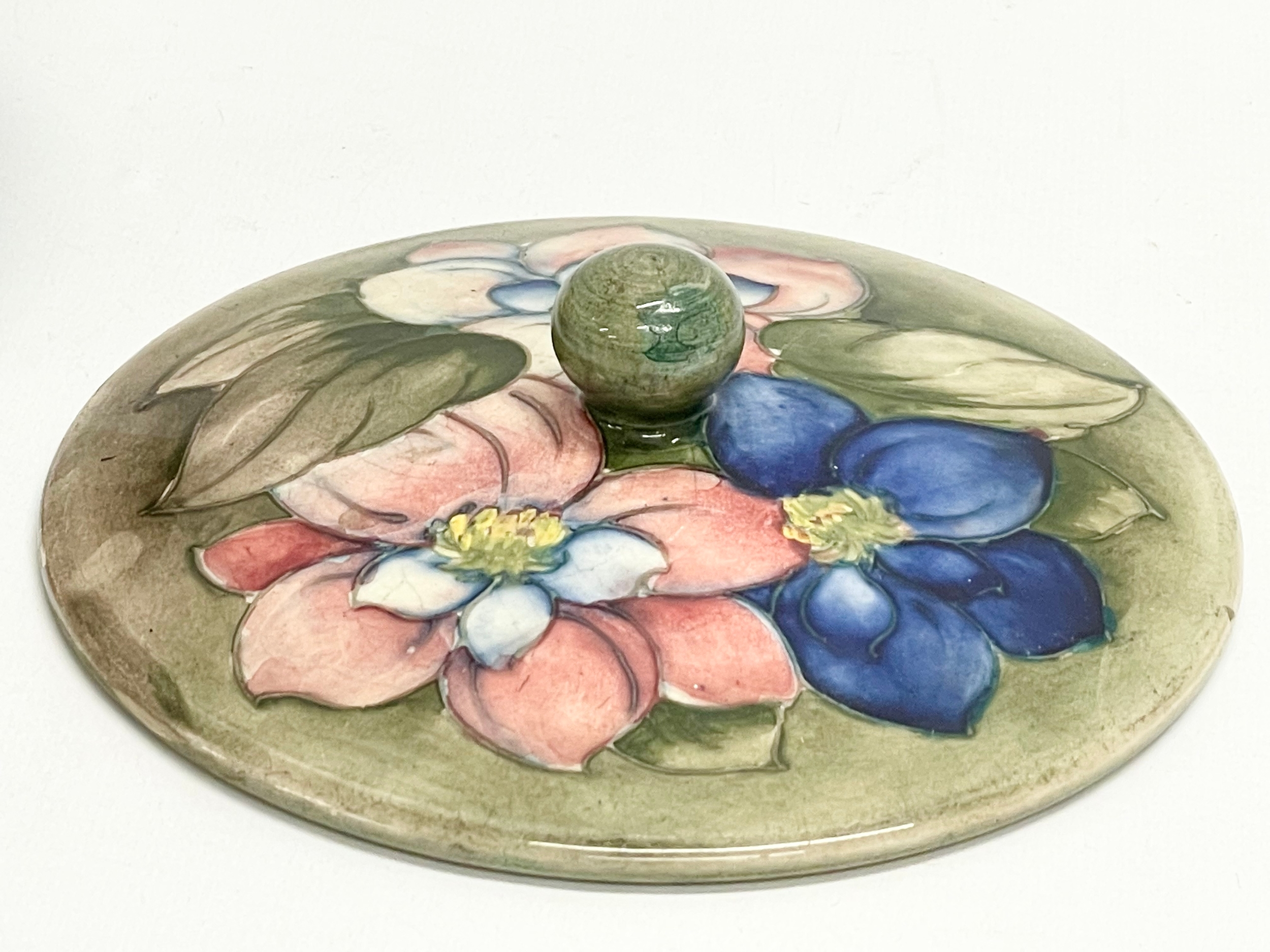A signed William Moorcroft ‘Clematis’ lidded powder bowl. Pottery to H. M. The Queen. 16x9cm - Image 8 of 9