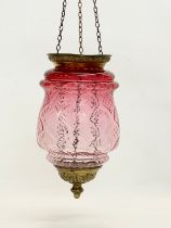 An early 20th century brass and Ruby Glass light shade. Circa 1900. Shade measures 21x34cm. 62cm