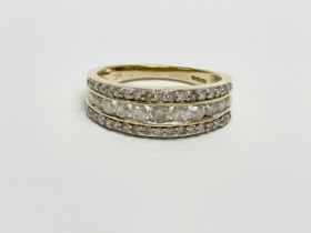 A 9ct gold diamond ring. 2.66 grams. Size N.