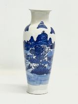 A 19th century Chinese blue and white landscape vase. 30.5cm