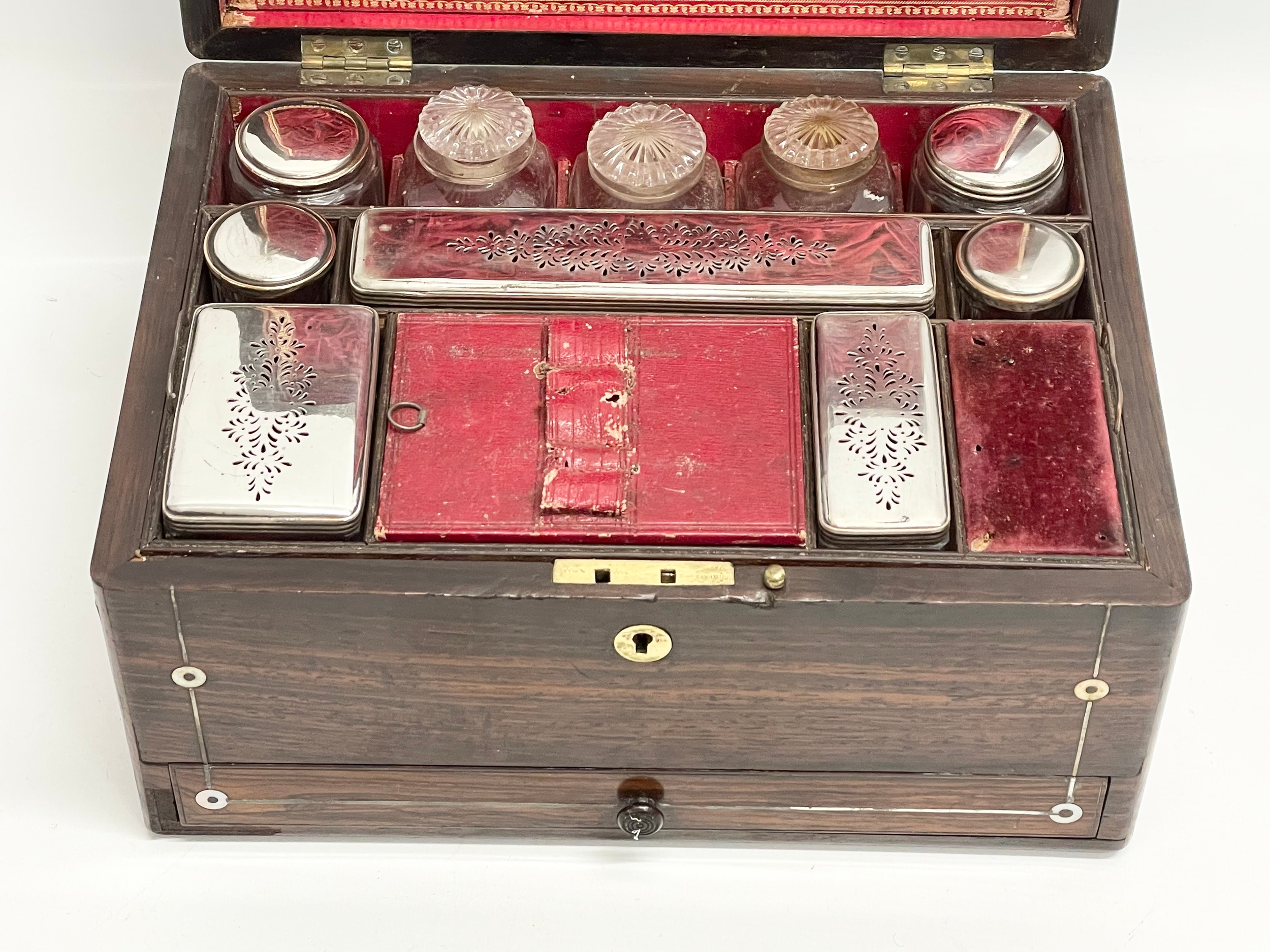 A Victorian rosewood vanity box with Mother of Pearl inlay and cut glass bottles with silver - Image 4 of 11