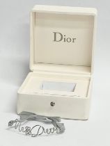 A ‘Miss Dior’ baby bracket with box