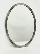 An early 20th century metal framed bevelled mirror. Circa 1910. 50x70cm