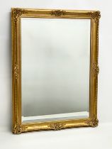 A good quality ornate gilt framed bevelled mirror. 60x81cm