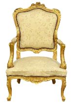 A vintage French 18th century style gilt framed armchair.