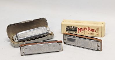 3 M. Hohner harmonicas, made in Germany.