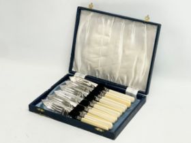 A silver mounted cutlery set in case.