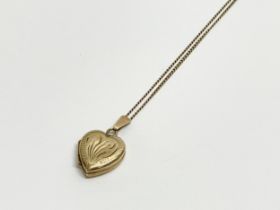 A 9ct gold locket necklace. 3.57 grams.