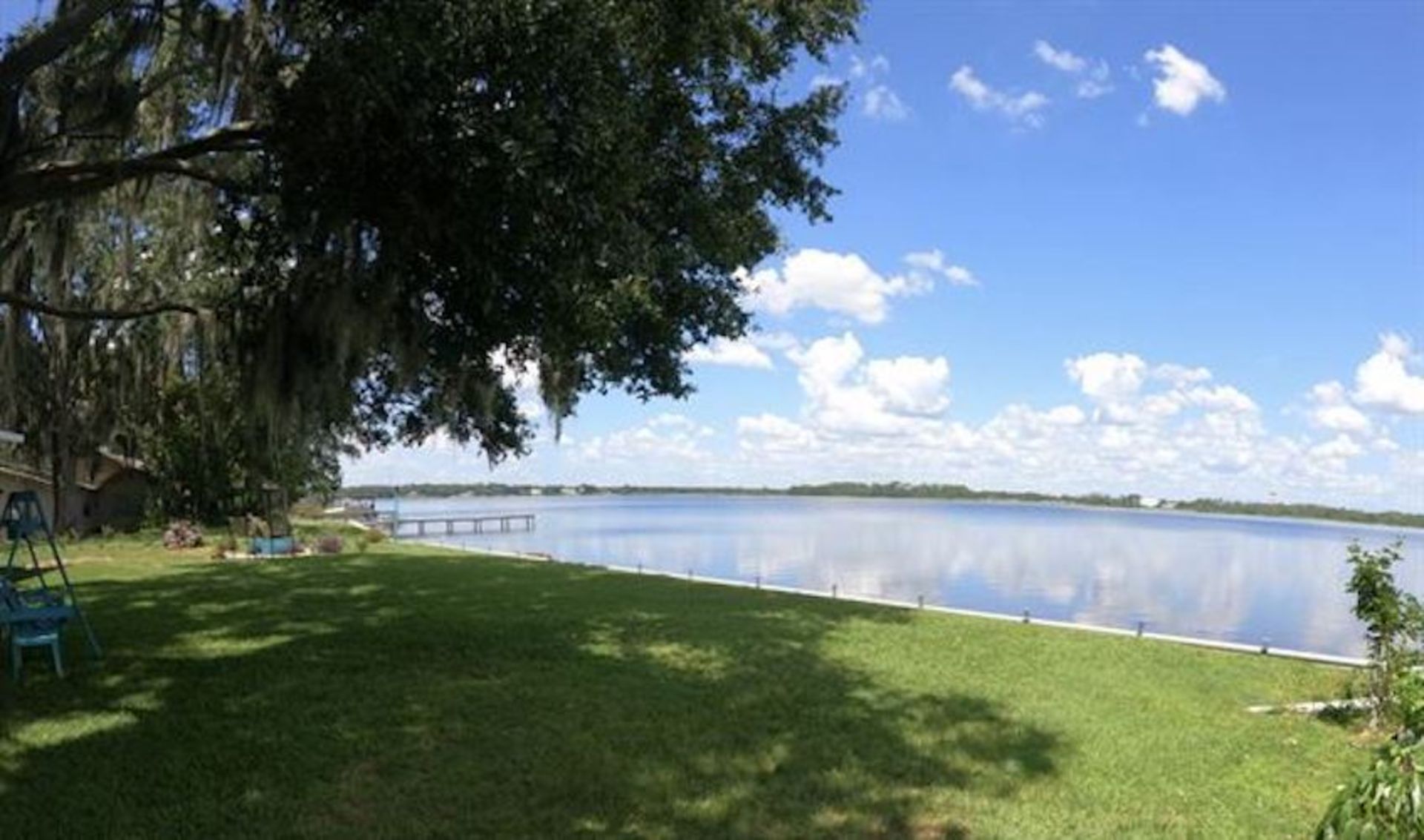 Embrace Nature's Splendor: Nearly 1.5 Acres Enveloped by the Kissimmee Chain of Lakes in Sunny FL!